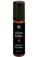 Load image into Gallery viewer, A 10ml roll-on bottle of Velvet Ember Cologne Oil for men, featuring a black cap and a black label with white text and a small red flame icon.