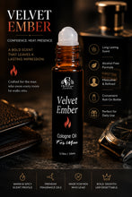Load image into Gallery viewer, A bottle of Velvet Ember Cologne Oil for Men by Cherrae Essentials, presented in an amber glass roll-on bottle with a white cap, set against a dark, moody background with a leather wallet, watch, and another bottle.