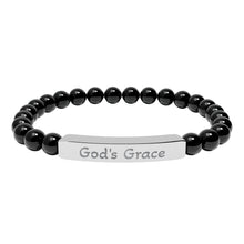 Load image into Gallery viewer, Black beaded bracelet with a silver tag reading &#39;God&#39;s Grace&#39; on a white background
