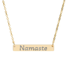 Load image into Gallery viewer, Gold necklace with 'Namaste' pendant on a white background
