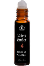 Load image into Gallery viewer, An amber glass bottle of Cologne Oil for men by Cherrae Essentials, labeled 'Velvet Ember', with a black label and a white rollerball cap, shown on a white background.
